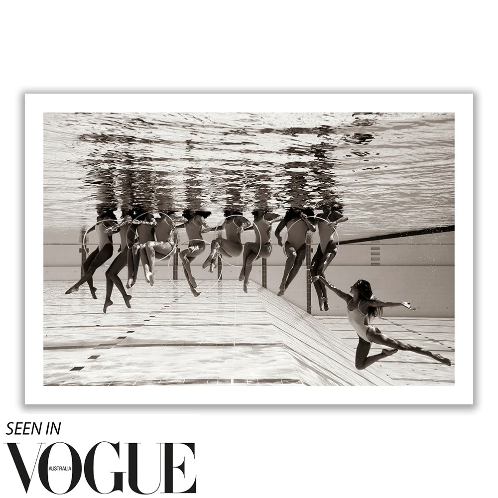 A group of synchronized swimmers, reminiscent of Olympic Artistic Swimming, performs underwater in a pool. Their movements create a mirrored reflection on the water's surface. This black and white image, titled *Ladies in Waiting #6* by Francesca Owen and printed on Giclee fine art paper, features the "Seen in Vogue Australia" text at the bottom.